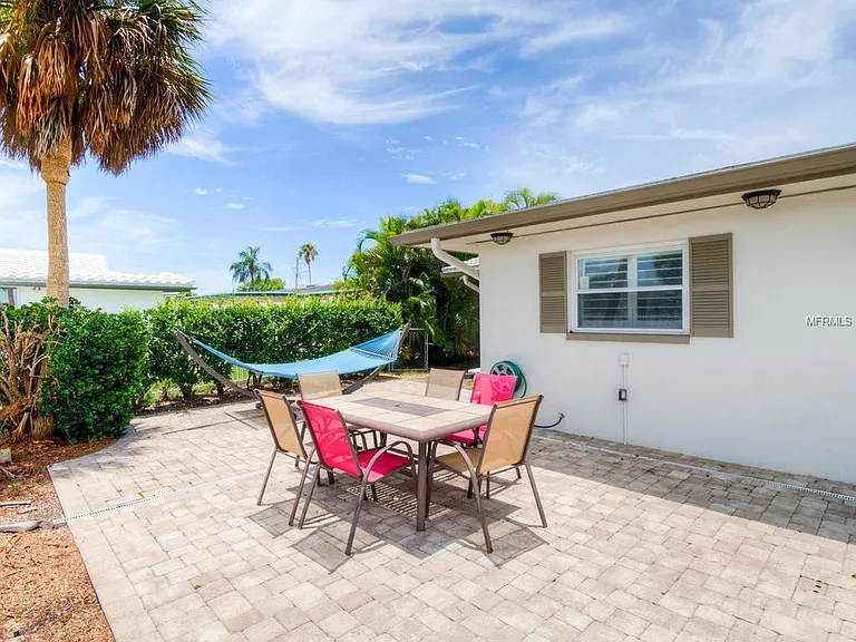Paver patio with dining table and hammock
