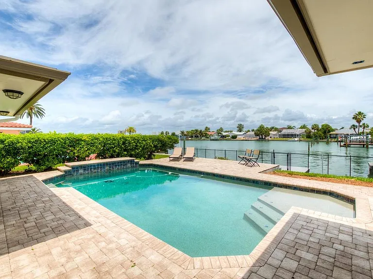 Waterfront pool and dock on Boca Ciega Bay at Palm Point